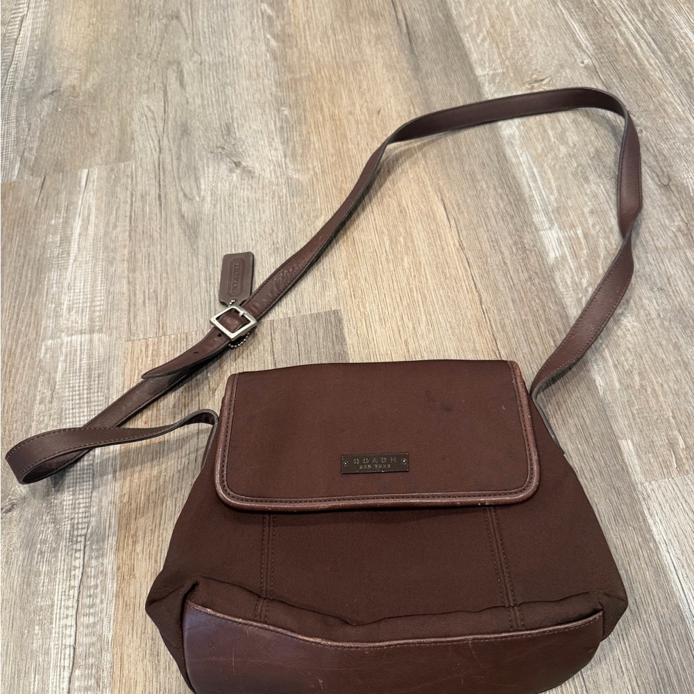 Vintage brown Coach neoprene and leather microfiber crossbody bag.